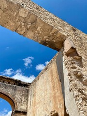 Symmetrical Shot of Historic, Ancient Ruin on an Archaeological Site with Weathered Stone Arches