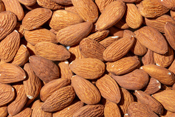 Scattered Almonds. Background from Almond Nuts. Natural High-Calorie Snacks