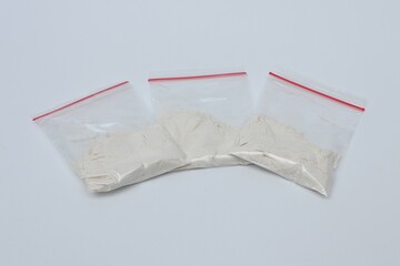 Narcotics in plastic packaging on white background