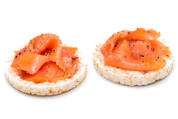 Tasty Rice Cake Sandwiches with Fresh Salmon Slices Isolated on White. Easy Breakfast and Diet Food. Crispbread with Red Fish. Healthy Dietary Snacks - Isolation