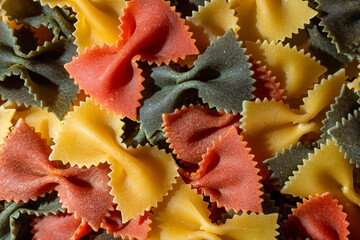 Uncooked Vibrant Colored Farfalle Pasta: A Culinary Canvas of Multicolored Bow-Tie Macaroni,...