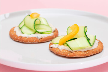 Crispy Cracker Sandwich with Fresh Cucumber, Yellow Paprika and Cottage Cheese on White Dish. Easy Breakfast. Quick and Healthy Sandwiches. Crispbread with Tasty Filling. Healthy Dietary Snack