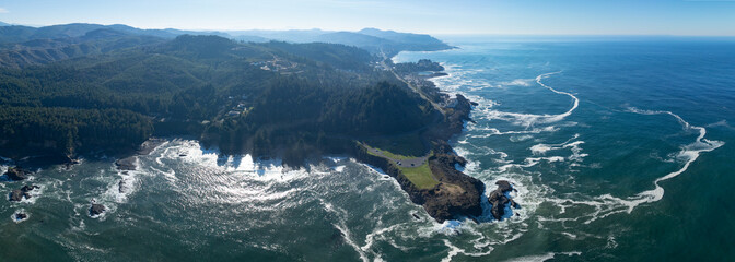 The Pacific Ocean washes against the rocky and rugged coastline of Oregon, not far south of Lincoln...