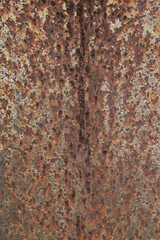 Texture or background of the walls of rusted steel sheets are an orange color, very dark and abstract.