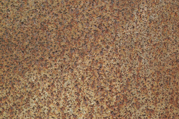 Texture or background of the walls of rusted steel sheets are an orange color, very dark and abstract.
