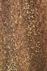 Texture or background of the walls of rusted steel sheets are an orange color, very dark and abstract.