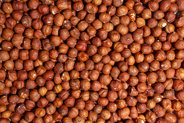Scattered Peeled Hazelnut - Top View. Background from Hazelnuts. Natural High-Calorie Snacks
