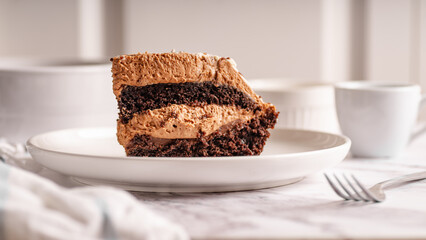 Chocolate Cake Slice on White Plate – Selective Focus

