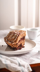 Chocolate Cake Slice on White Plate – Selective Focus

