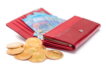Opened Red Women Purse with 20 Euro Banknotes Inside and Bitcoin Coins - Isolated on White Background. A Wallet Full of Money Symbolizing Wealth, Success, Shopping and Social Status - Isolation