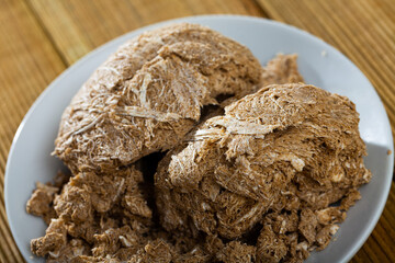 Delicious sunflower halva on wooden table, sweet food