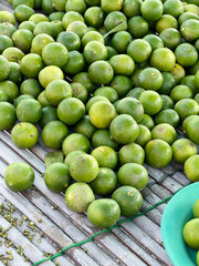 fresh green limes in a bowl