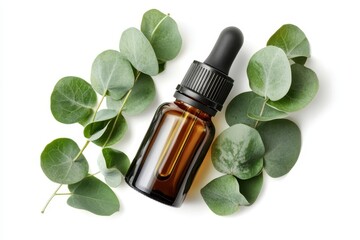 Eucalyptus oil in amber dropper bottle with green leaves on white background