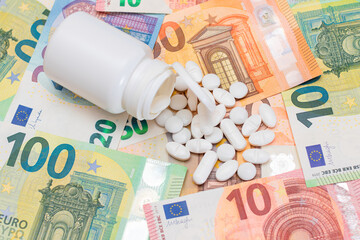 Expensive Medicine and Inflation Concept: Pills and Capsules on the Euro Banknotes. Global Pharmaceutical Industry and Big Pharma. Euro Money Bills