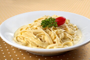 Fettuccine with Alfredo sauce on plate
