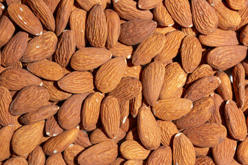 Scattered Almonds. Background from Almond Nuts. Natural High-Calorie Snacks