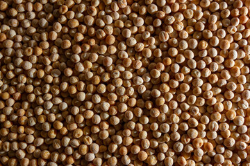 Uncooked Yellow Polished Peas Background. A Culinary Canvas of Dry Yellow Peas, Creating a Lively and Textured Background for Gourmet Cooking. Scattered Raw Polished Peas. Healthy Eating Ingredients