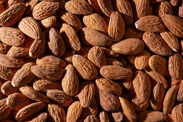 Scattered Almonds. Background from Almond Nuts. Natural High-Calorie Snacks