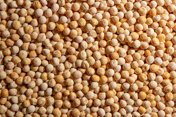 Uncooked Yellow Polished Peas Background. A Culinary Canvas of Dry Yellow Peas, Creating a Lively and Textured Background for Gourmet Cooking. Scattered Raw Polished Peas. Healthy Eating Ingredients