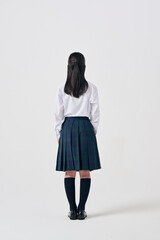 白背景,日本人女子中学生の後ろ姿
