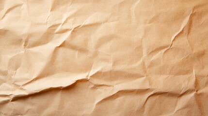 A close-up of crumpled, brown paper, showcasing its texture and natural imperfections against a neutral background.
