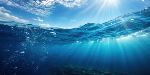 Fototapeta premium Perfectly seamless deep blue ocean waves with micro particles and light rays shining through, ocean, waves