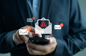 Cyber crime email Spam concept. Person use smartphone with virtual screen of Spam email...