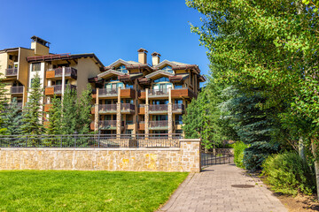 Vail, Colorado ski resort summer town of Lionshead village with condominium apartment buildings, lodge hotel architecture