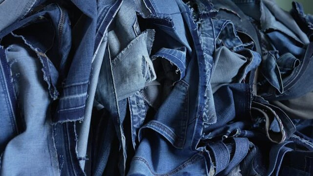 Heap blue denim fabric scrap. Old jeans for upcycle reuse or recycle