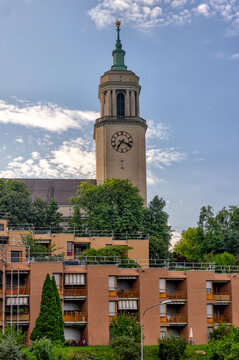 Zurich, Switzerland - July 26, 2024: The clock tower of Grosse Kirche Fluntern church in Zurich Switzerland
