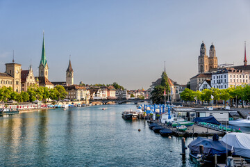 Obraz premium Zurich, Switzerland - July 26, 2024: The waterfront and old town at the mouth of the Limmat Riverl in Zurich Switzerland 