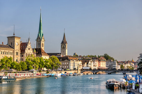 Zurich, Switzerland - July 26, 2024: The waterfront and old town at the mouth of the Limmat Riverl in Zurich Switzerland
