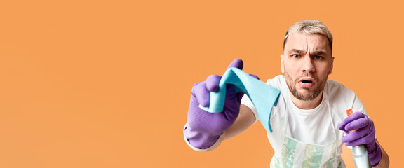 Housekeeping concept. Funny boy wiping screen sponge, free space