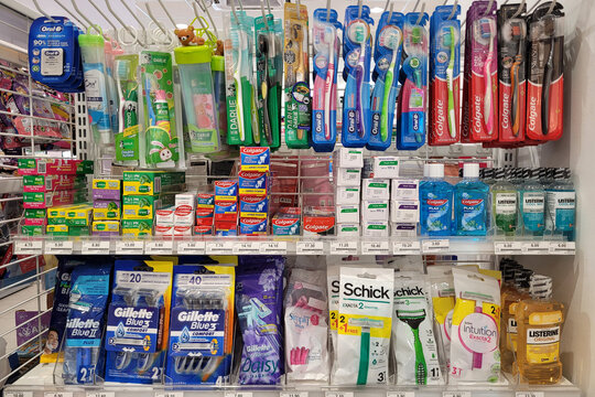 Penang, Malaysia - Oct 26, 2024: Oral hygiene and personal care section in a FamilyMart convenience store featuring toothbrushes, toothpaste, razors, and mouthwash