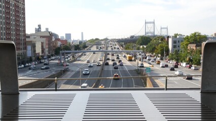Triborough Bridge in Astoria, Robert F. Kennedy Bridge, New York City. Car traffic on road, multiple lane transport highway from elevated subway station in Queens near Ditmars Steinway, NYC, USA.