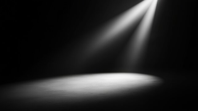 A dramatic spotlight shines on a dark stage, creating a focus point on the ground, This image can be used for themes like performance, creativity