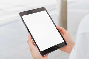 Mock up of female hand holding digital tablet blank screen on isolated. Take your screen to put on advertising.