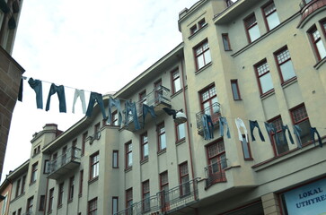 jeans hanging on clothing line in city