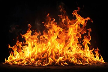 Fototapeta premium close-up of blazing fire flame on black background