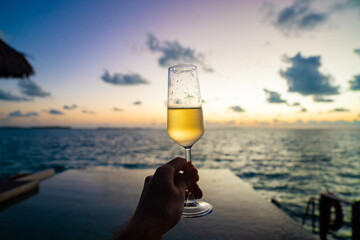 Sunset views from overwater pool villa in Maldives
