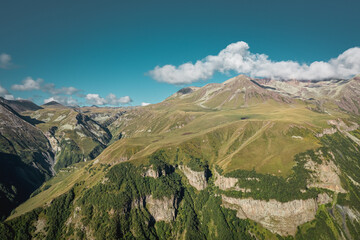 Stunning Aerial View of the Majestic Mountain Landscape, Set Beneath a Clear and Beautiful Blue Sky