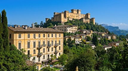 Majestic Castle Perched on Hilltop Above Historic Italian Village