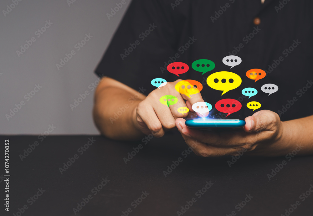 Aufkleber close-up of hands using a smartphone with colorful chat bubbles.