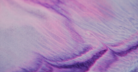 Purple leak. Marbling overflow. Figurative texture of paint pouring acrylic different colors. Violet stream artistic background with bright enamel glitter powder.