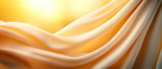 Obraz premium Soft golden fabric draping elegantly, capturing the essence of warmth and light for artistic and design projects.
