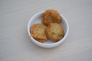 Perkedel is fried patties, made of ground potatoes and minced meat and vegetables