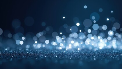 Shimmering silver holiday lights against a deep midnight blue background creating a sparkling effect.