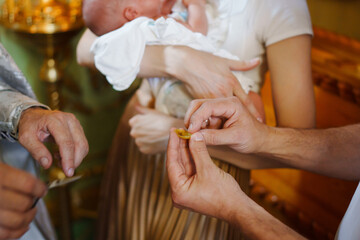 The process of baptizing a baby in the Orthodox Church. 