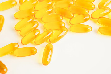 Fish oil or Cod liver oil gel in capsules with omega 3 vitamins, supplementary healthy food.