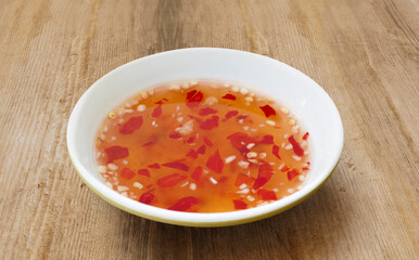 Sweet and Sour Chili garlic dipping fish Sauce bowl. Nuoc mam. Vietnamese fish sauce isolated....